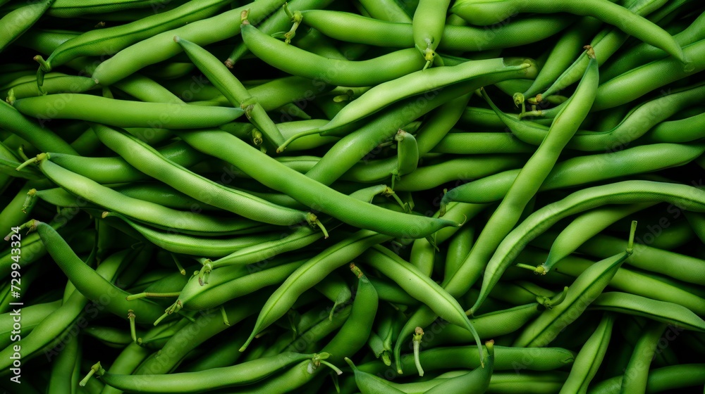 Green beans with water drops on a black background. Top view. Green beans with water drops on a black background. Top view.