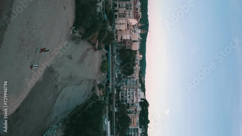 Vertical dronie over a little coast village on the mediterranean sea, Arenys de Mar, Maresme, Catalunya, Spain photo