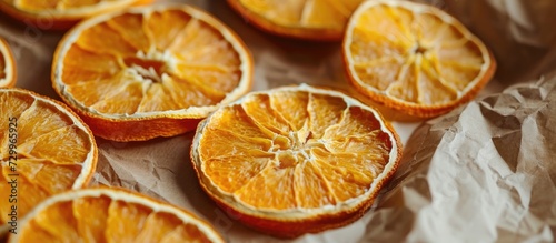 Homemade dehydrated orange slices in a Kraft paper package