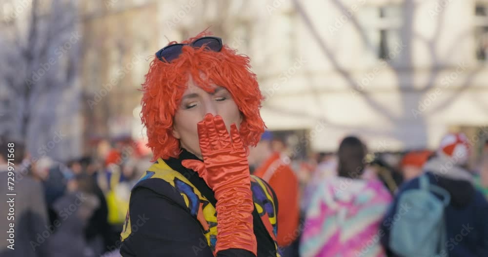 Carnival - Cheerful, costumed woman dancing, blowing a kiss and giving a thumbs up. Handheld shot. Slow-mo. Carnival - Cheerful, costumed woman dancing, blowing a kiss and giving a thumbs up. Handheld shot. Slow-mo.