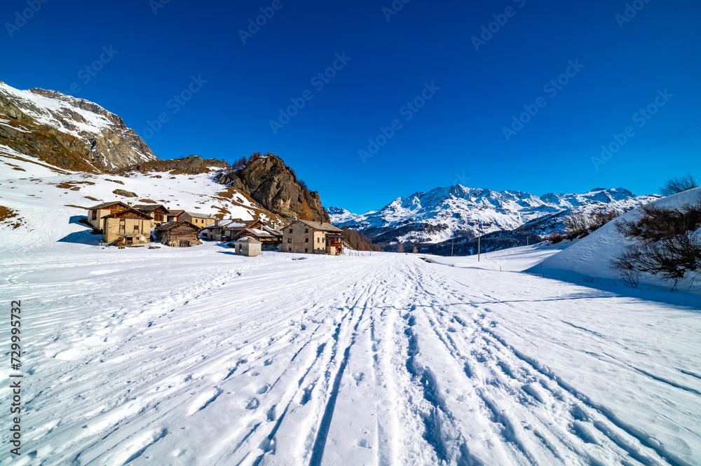 Panoramic view of the Engadine, Lake Sils, and the village Grevasalvas, in winter.