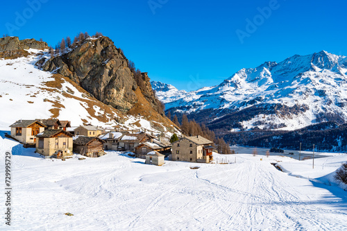 Panoramic view of the Engadine, Lake Sils, and the village Grevasalvas, in winter. © leledaniele