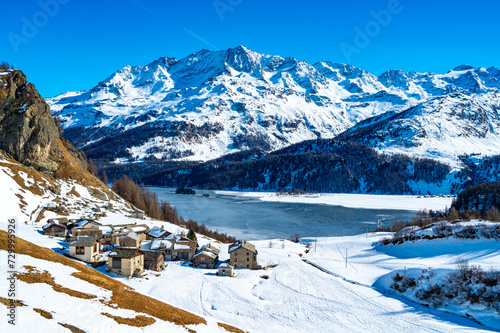 Panoramic view of the Engadine, Lake Sils, and the village Grevasalvas, in winter.