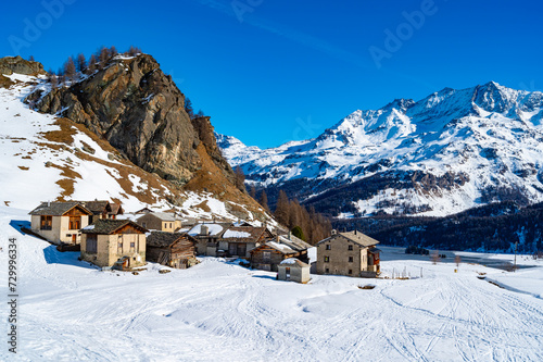 Panoramic view of the Engadine, Lake Sils, and the village Grevasalvas, in winter. © leledaniele