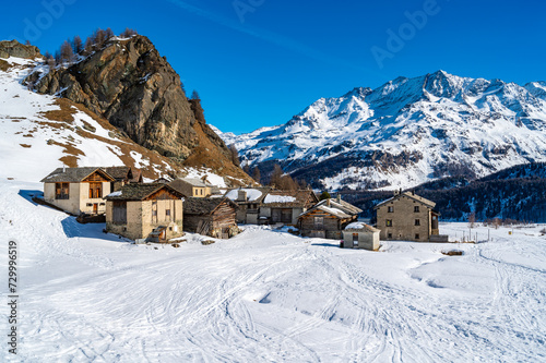 Panoramic view of the Engadine, Lake Sils, and the village Grevasalvas, in winter.