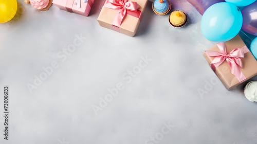 Festive background with colorful balloons, gifts. Birthday, holiday concept. Birthday or holiday party card. Copy space. Gray background. View from above