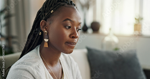 Tableau sur toile Stress, doubt and black woman on sofa, thinking and worry with mental health in apartment living room