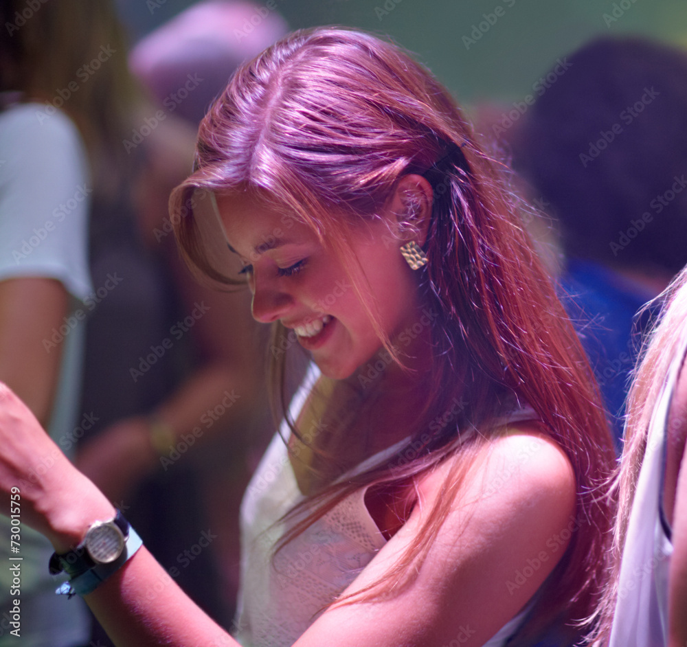 Fototapeta premium Woman, happy and dancing at party or club, smiling and entertainment at special event on weekend. Female person, joy and freedom at concert on vacation or holiday, celebrating and music festival