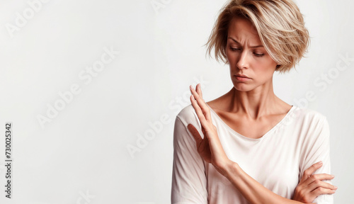 Young woman suffering from pain in her elbow. Pain in the elbow.