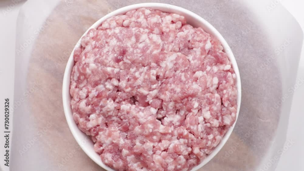uncooked minced pork in bowl top view uncooked minced pork in bowl top view