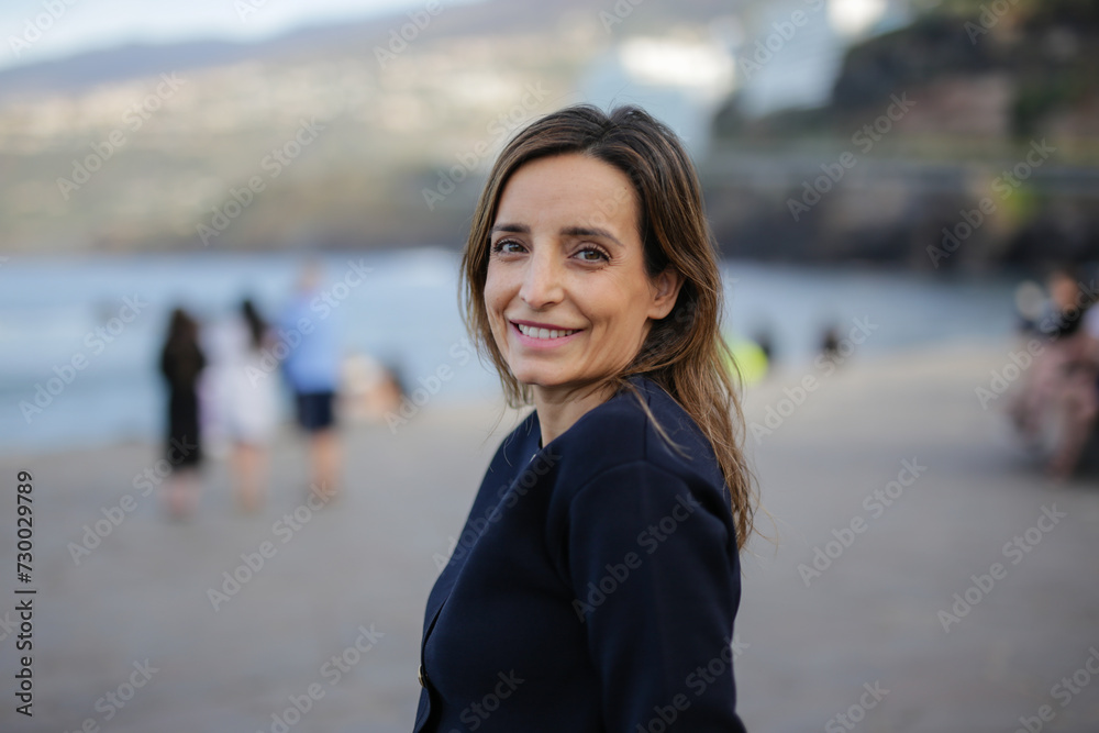 Smiling woman looking at camera. Redefining 40. Joy, Vitality and Experience Smiling woman looking at camera. Redefining 40. Joy, Vitality and Experience