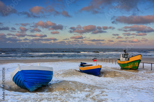 Fishing boats on the Baltic Sea beach in Jantar at winter. Poland
