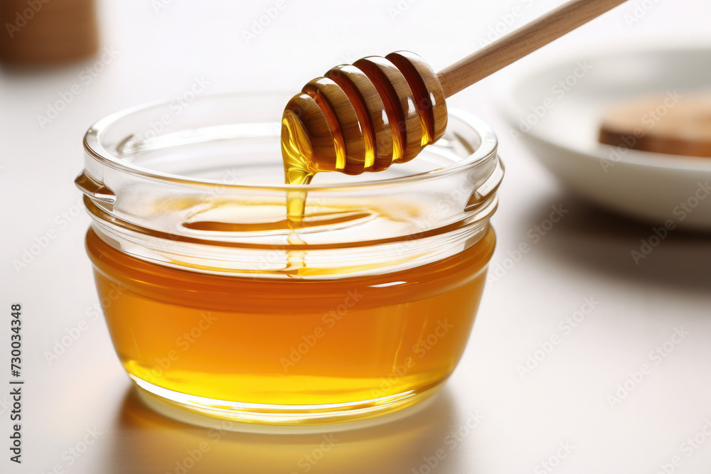 Fresh honey, ready to eat with a wooden spoon Fresh honey, ready to eat with a wooden spoon