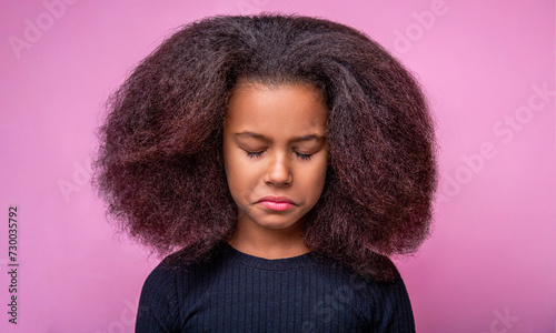 Portrait upset little african american. Emotions and sorrow, bad mood, being sad, unhappy. Sad offended american girl cries. Little unhappy afro girl. Alone and scared, sad depressed children crying photo