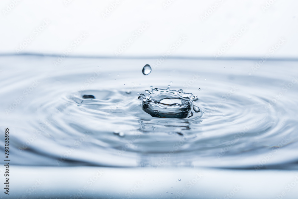 Mesmerizing splash captured against a pristine white backdrop. Perfect for advertising water-related products or promoting relaxation. Mesmerizing splash captured against a pristine white backdrop. Perfect for advertising water-related products or promoting relaxation.