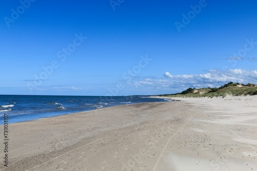 The coast of the Baltic Sea near Leba destination and Slovenian National Park with the largest sand dunes in Europe