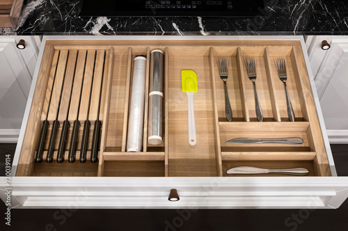 Wood kitchen drawer organizer, utensil holder with simple set of kitchen tools, furniture details