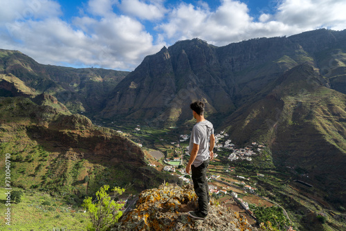 Young man contemplates the landscape. Agaete Valley. Gran Canaria. Canary Islands photo