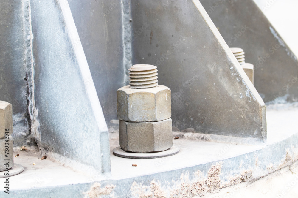 Bolts and screws. Old big Metal male square nut screw nail heads stackable to attach to large light pole bases. To attach structure of wall to be strong for house or various industrial. Bolts and screws. Old big Metal male square nut screw nail heads stackable to attach to large light pole bases. To attach structure of wall to be strong for house or various industrial.