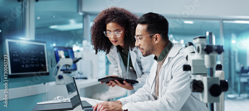 Science, teamwork and scientist with tablet in laboratory for communication, pharmaceutical review or planning. Employees, collaboration and technology for research, discussion and digital analysis photo