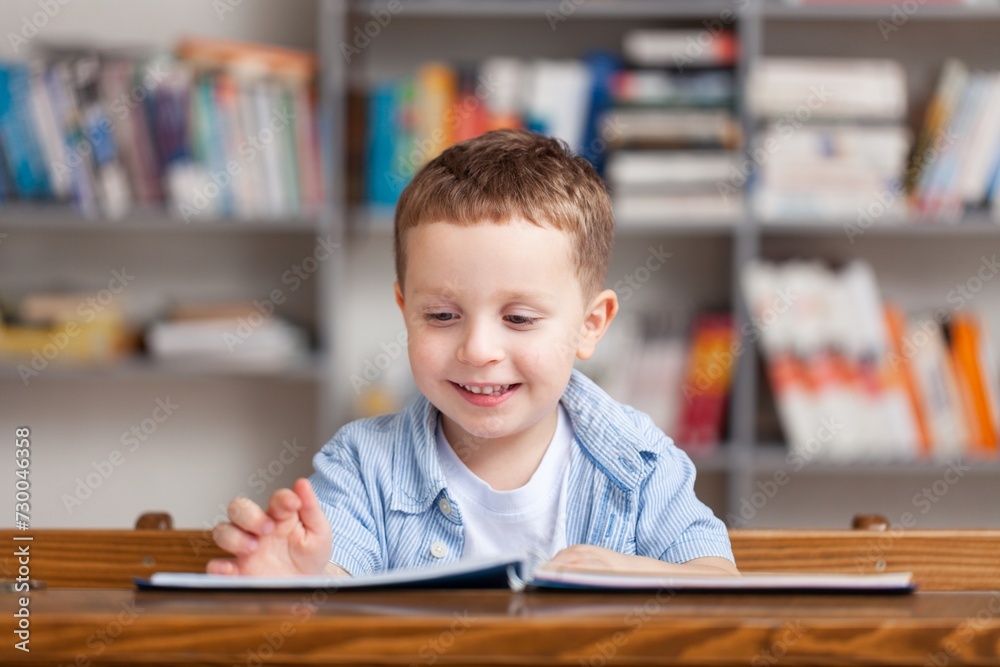 Happy school children learning in classroom Happy school children learning in classroom