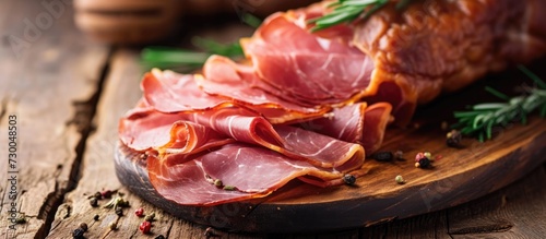 Dry ham on a wooden surface. photo