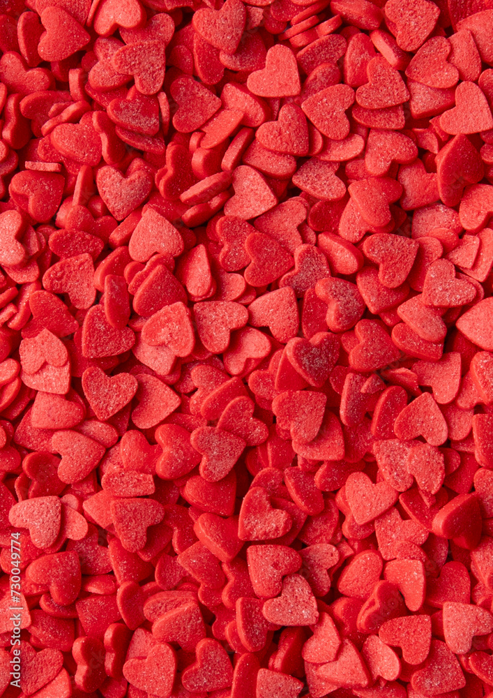 Red Heart-Shaped Sprinkles Background. Valentine's Day Concept. Red Heart-Shaped Sprinkles Background. Valentine's Day Concept.
