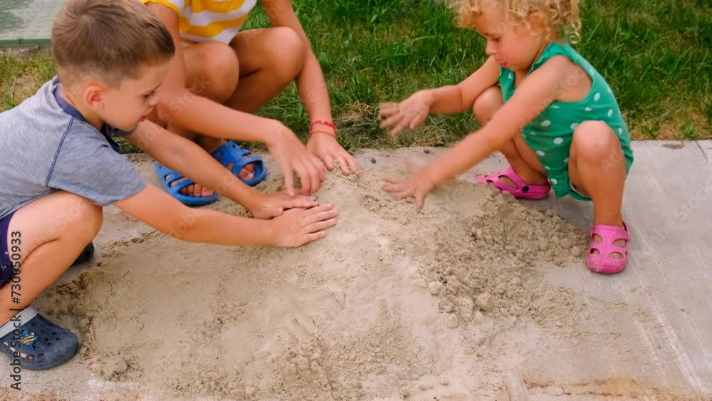 child plays in the sandbox. Selective focus. child plays in the sandbox. Selective focus.