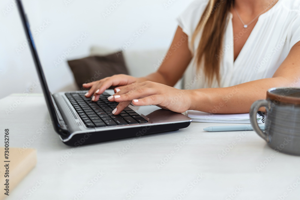 Naklejka premium Elegant, professional and freelance worker on her laptop inside home office. Formal, stylish and fashionable corporate employee online. Remote, communication and sending emails in digital workplace.