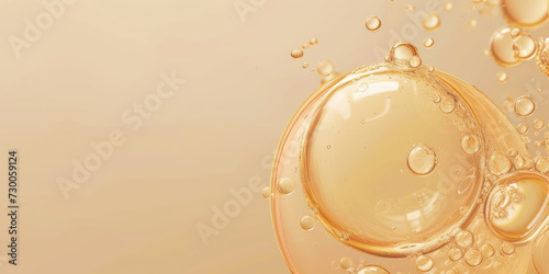 Close-up of golden oil bubbles suspended, creating a luxurious and rich texture against a soft, warm bokeh background.