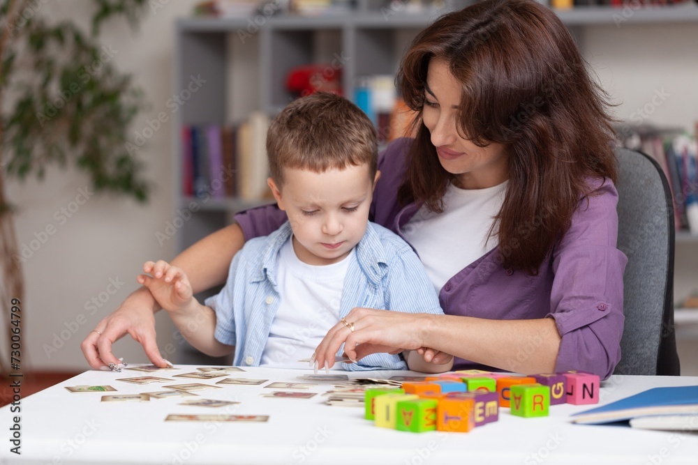 Teacher learning little child in classroom. Preschool education concept Teacher learning little child in classroom. Preschool education concept