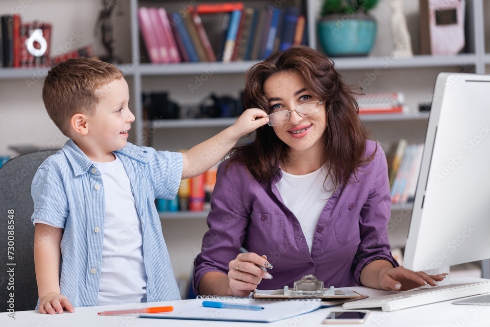 Beautiful young mother working it home with little spoiled child. Beautiful young mother working it home with little spoiled child.