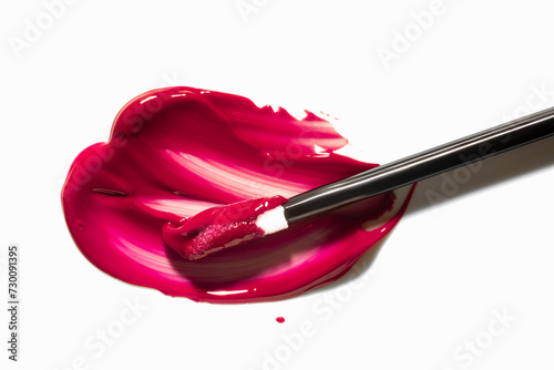 Cherry red cosmetic smudge lip gloss or tint swatches with applicator isolated on white photo