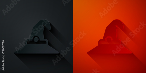 Paper cut Witch hat icon isolated on black and red background. Happy Halloween party. Paper art style. Vector