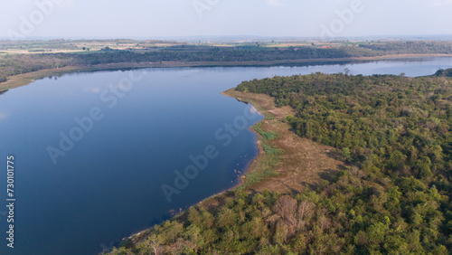 Aerial view of the reservoir dam and forest at a rural countryside