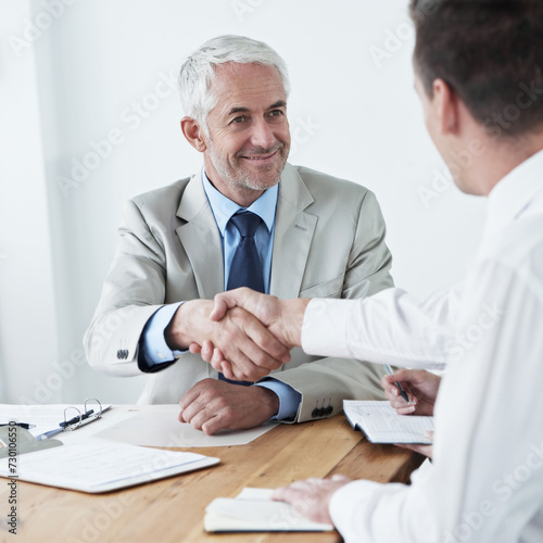 Handshake, happy business people or documents for partnership agreement or welcome in meeting. Shaking hands, b2b or corporate lawyers in collaboration for teamwork with contract, deal or paperwork