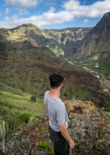 Young man contemplates the landscape. Agaete Valley. Gran Canaria. Canary Islands