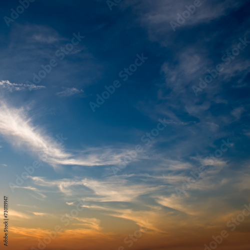 Blue sky with cirrus clouds and bright sun rise.