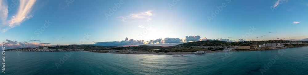 panorama landscape view of Mellieha Bay in Malta at sunset