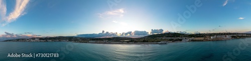 panorama landscape view of Mellieha Bay in Malta at sunset photo