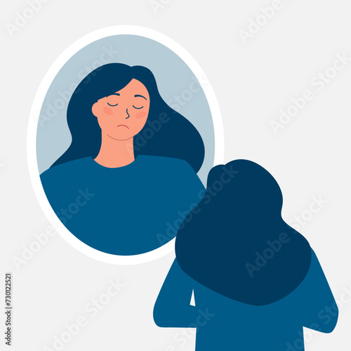 Fototapeta Naklejka Na Ścianę i Meble -  Sad depressed girl looking in the mirror. A girl dissatisfied with herself is sad standing near the mirror. self-dislike