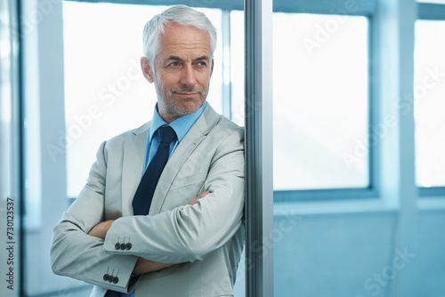 Businessman, mature and thinking in corporate office for consulting firm growth, achievement or target. Male person, professional and thought with confidence for company future, idea or brainstorming