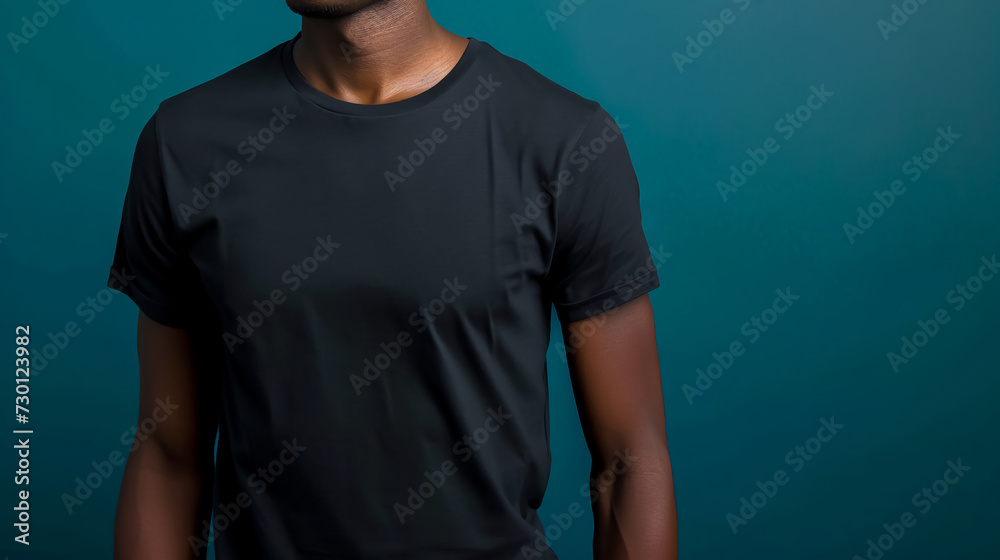 Blank black t-shirt on black man, clothing mockup, blue background Blank black t-shirt on black man, clothing mockup, blue background