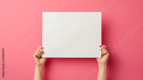  lady with expressing support, understanding, or kindness, holding hands paper, side white empty space poster proposing buy advert place, isolated on solid color background photo