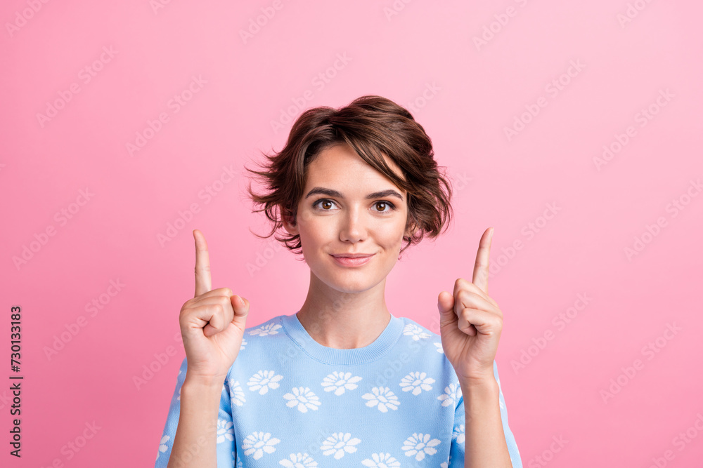 Portrait of positive nice girl indicate fingers up above empty space proposition isolated on pink color background Portrait of positive nice girl indicate fingers up above empty space proposition isolated on pink color background