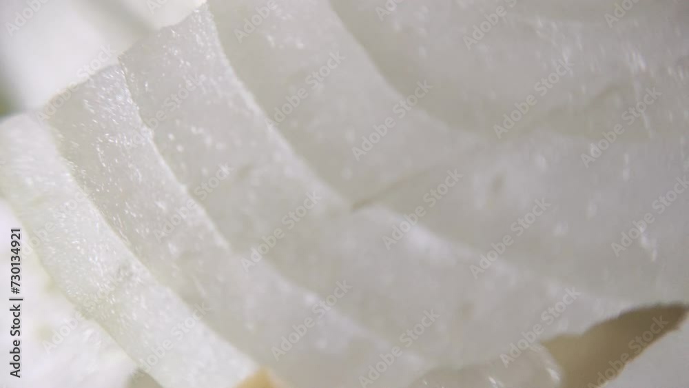 Onion cut into pieces, macro video Onion cut into pieces, macro video
