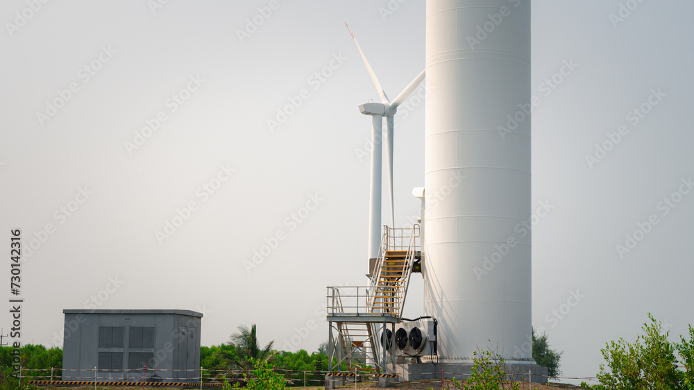 Windmill's turbine gracefully harnesses wind's power, converting it into electricity through generator. Sustainable technology exemplifies promise of renewable energy for greener, ecological future Windmill's turbine gracefully harnesses wind's power, converting it into electricity through generator. Sustainable technology exemplifies promise of renewable energy for greener, ecological future