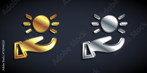 Gold and silver Ball levitating above hand icon isolated on black background. Levitation symbol. Long shadow style. Vector