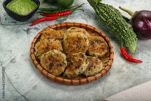 Indian style - chicken kebab with herbs photo