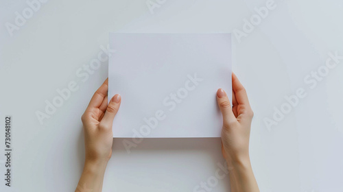 White Background: Woman's Hands Holding Paper